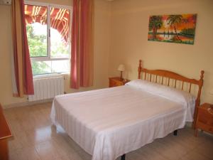 Postel nebo postele na pokoji v ubytování Hostal Imperial