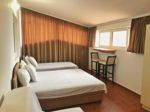 Postel nebo postele na pokoji v ubytování Apartmani Lasta