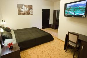 Säng eller sängar i ett rum på Penzion Kastiel