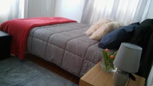 A bed or beds in a room at Central Location