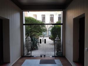 an open door with a view of a courtyard at The place to be in Arras