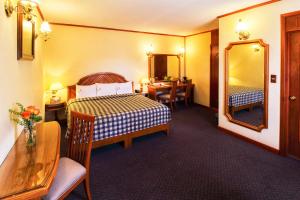 En eller flere senge i et værelse på Hotel Lastra