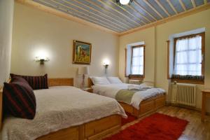 Łóżko lub łóżka w pokoju w obiekcie La Galba