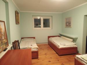 Posteľ alebo postele v izbe v ubytovaní Willa Kryształowa
