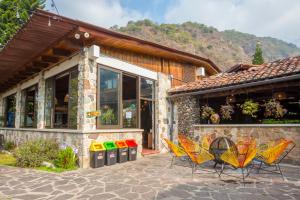 a group of chairs sitting outside of a building at Selina Atitlan in Panajachel