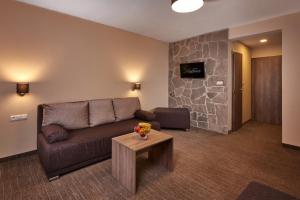 TV in/ali zabaviščno središče v nastanitvi Hotel Studničky
