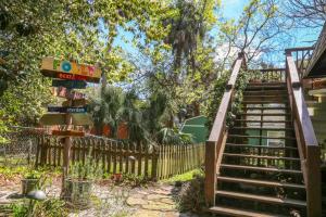 a set of stairs leading up to a playground at Shell Station House in Folly Beach