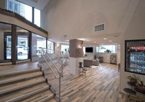 a lobby with a staircase in a building at Candlewood Suites Baltimore - Inner Harbor, an IHG Hotel in Baltimore