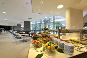 a buffet line with fruits and vegetables in a restaurant at Hotel Mediteran Plava Laguna in Poreč