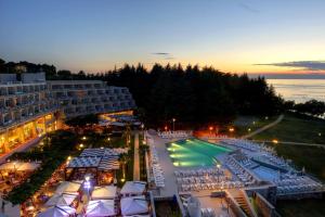 an aerial view of a resort with a tennis court at Hotel Mediteran Plava Laguna in Poreč