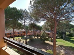 a view from the balcony of a building with trees at Résidence Golfs de Valescure 9 in Saint-Raphaël