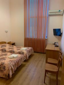 Postel nebo postele na pokoji v ubytování Inn on Zhytomyrska