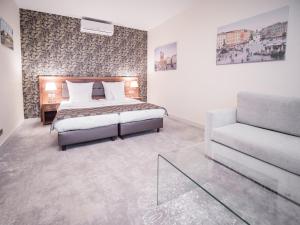 Posteľ alebo postele v izbe v ubytovaní Hotel Miodowa