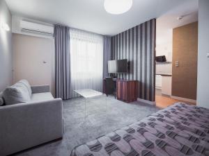 Posteľ alebo postele v izbe v ubytovaní Hotel Miodowa