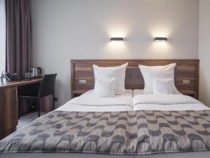 Posteľ alebo postele v izbe v ubytovaní Hotel Miodowa