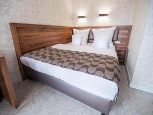 Posteľ alebo postele v izbe v ubytovaní Hotel Miodowa