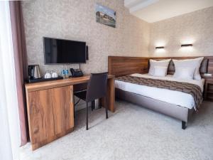 Posteľ alebo postele v izbe v ubytovaní Hotel Miodowa