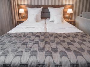 Posteľ alebo postele v izbe v ubytovaní Hotel Miodowa