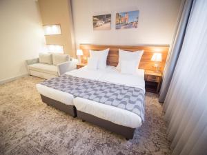 
Łóżko lub łóżka w pokoju w obiekcie Aparthotel Miodowa
