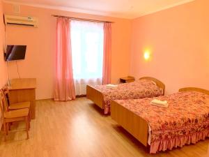 Postel nebo postele na pokoji v ubytování Inn on Zhytomyrska