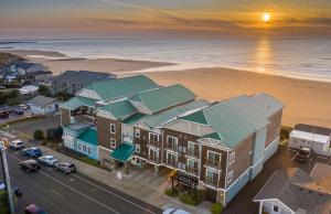 an aerial view of a building with a beach at Inn at Nye Beach in Newport