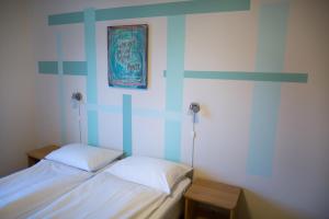 Ένα ή περισσότερα κρεβάτια σε δωμάτιο στο Lyngmo Gjestehus