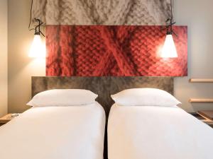 Letto o letti in una camera di ibis Baden Neuenhof