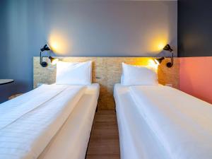Rúm í herbergi á ibis Styles Wien Messe Prater