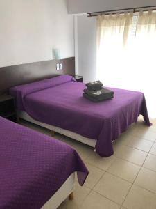 Tempat tidur dalam kamar di Hotel Nilmar