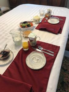 a table with plates and bowls of food on it at Your home away from home in Kelowna