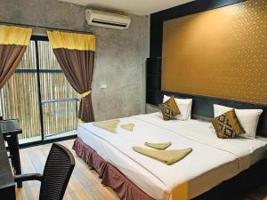 Voodi või voodid majutusasutuse Phi Phi Andaman Legacy Resort toas