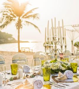 a table on the beach with a table set with candles at InterContinental Pattaya Resort by IHG in Pattaya South +123 photos