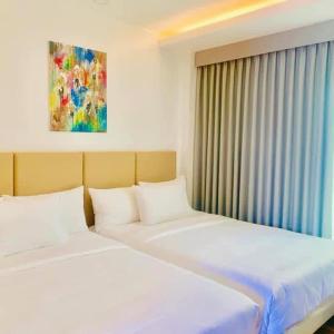 Tempat tidur dalam kamar di Ciabel Hotel and Fitness Center