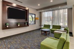 a waiting room with chairs and a flat screen tv at Holiday Inn Express Fishkill, an IHG Hotel in Fishkill