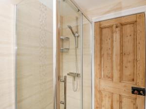 a shower with a glass door in a bathroom at 49 Ulwell Road in Swanage +42 photos