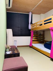 Postel nebo postele na pokoji v ubytování Hilo Hostel