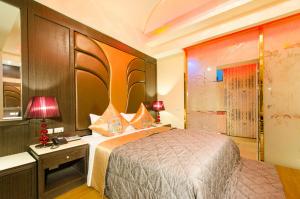 Postel nebo postele na pokoji v ubytování Zheng Yi Classic Hotel & Motel