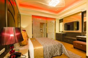 TV a/nebo společenská místnost v ubytování Zheng Yi Classic Hotel & Motel