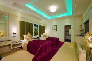Postel nebo postele na pokoji v ubytování Zheng Yi Classic Hotel & Motel