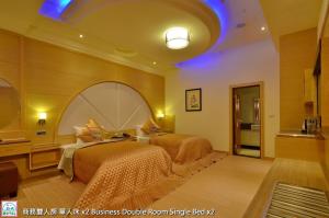 Postel nebo postele na pokoji v ubytování Zheng Yi Classic Hotel & Motel