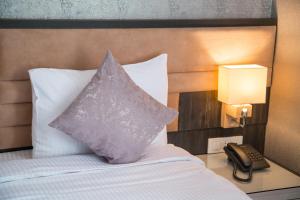 Postel nebo postele na pokoji v ubytování Parkway Inn Hotel & Spa