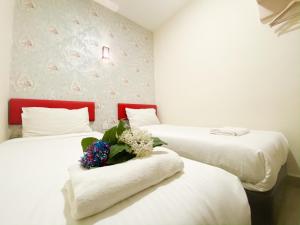 Postel nebo postele na pokoji v ubytování Carlsun Hotel