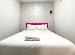 Postel nebo postele na pokoji v ubytování Carlsun Hotel