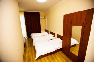 Postel nebo postele na pokoji v ubytování Ortachala Palace