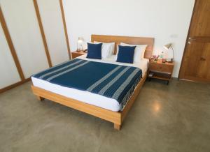 A bed or beds in a room at Ubuntu Beach Villas by Reveal