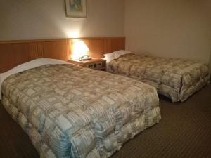 Letto o letti in una camera di The Gran Resort Arima