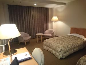 Letto o letti in una camera di The Gran Resort Arima