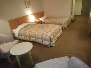 Letto o letti in una camera di The Gran Resort Arima