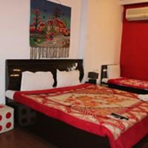 Postel nebo postele na pokoji v ubytování Hotel Om Complex