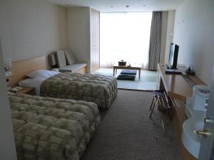 Letto o letti in una camera di The Gran Resort Arima